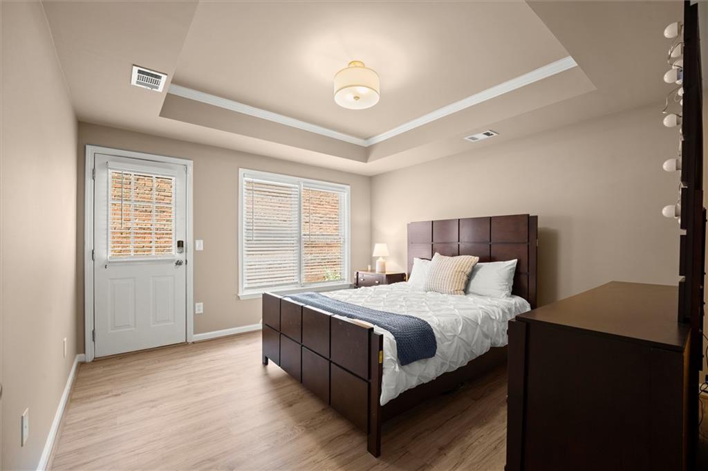 6229 Grand Loop Road Sugar Hill, GA 30518 - Photo 57 of 93 a bedroom with a bed and a window