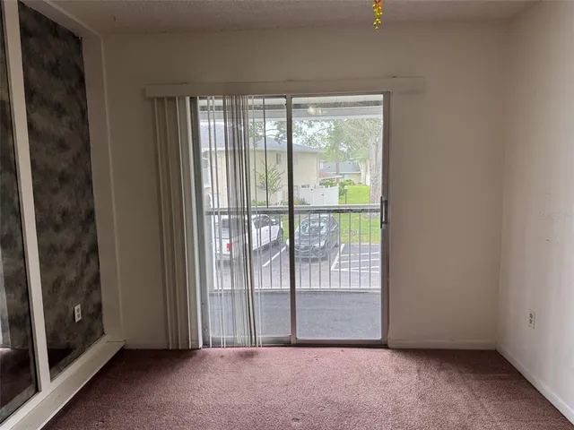 a view of a room with large windows