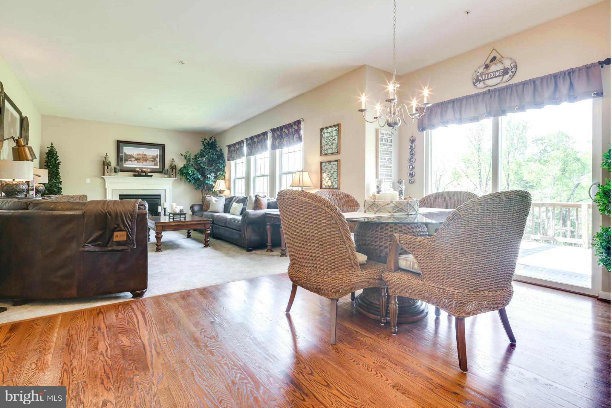 6020 Cypress Springs Road Elkridge, MD 21075 - Photo 3 of 29 a view of a dining room with furniture window and wooden floor
