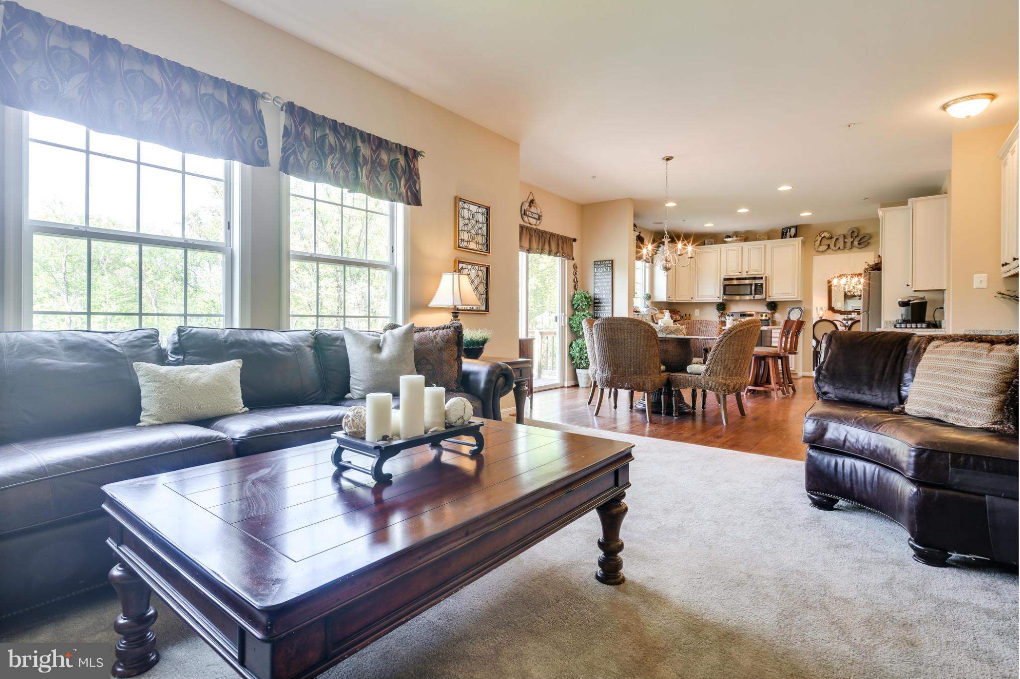 6020 Cypress Springs Road Elkridge, MD 21075 - Photo 5 of 29 a living room with furniture and a large window