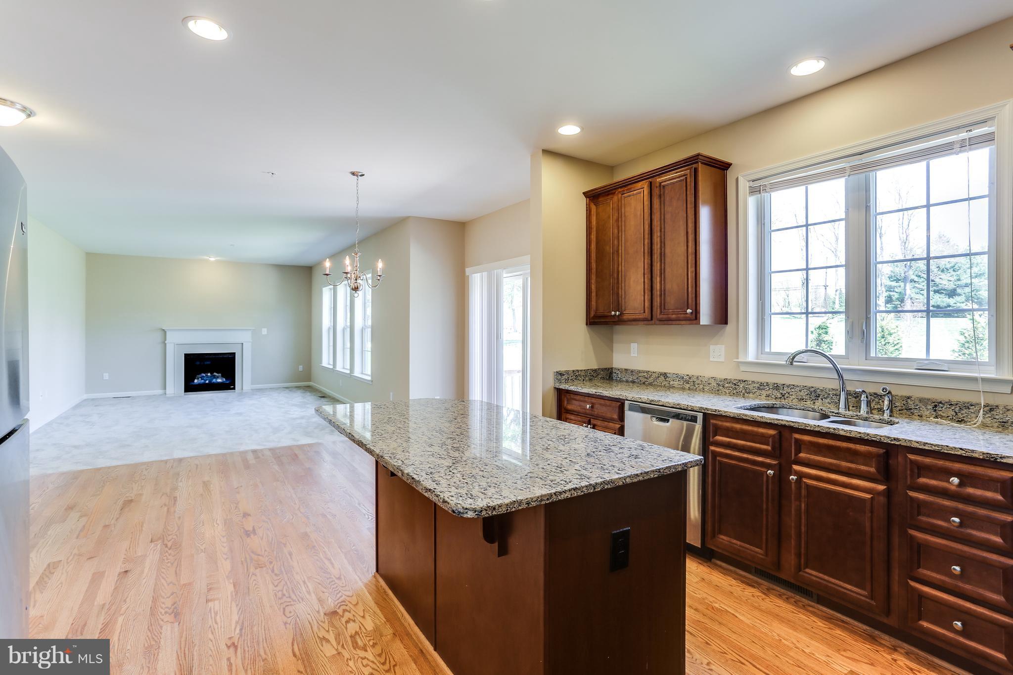6020 Cypress Springs Road Elkridge, MD 21075 - Photo 8 of 29 a kitchen with a sink stove and cabinets