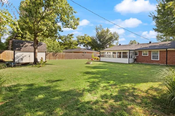 a view of a house with a big yard