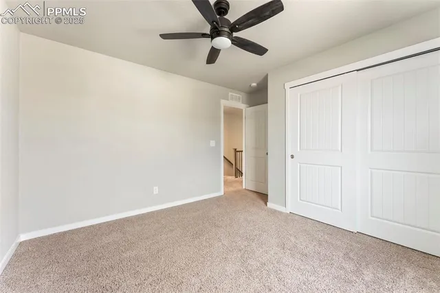 a bathroom with a granite countertop sink a toilet a mirror and shower