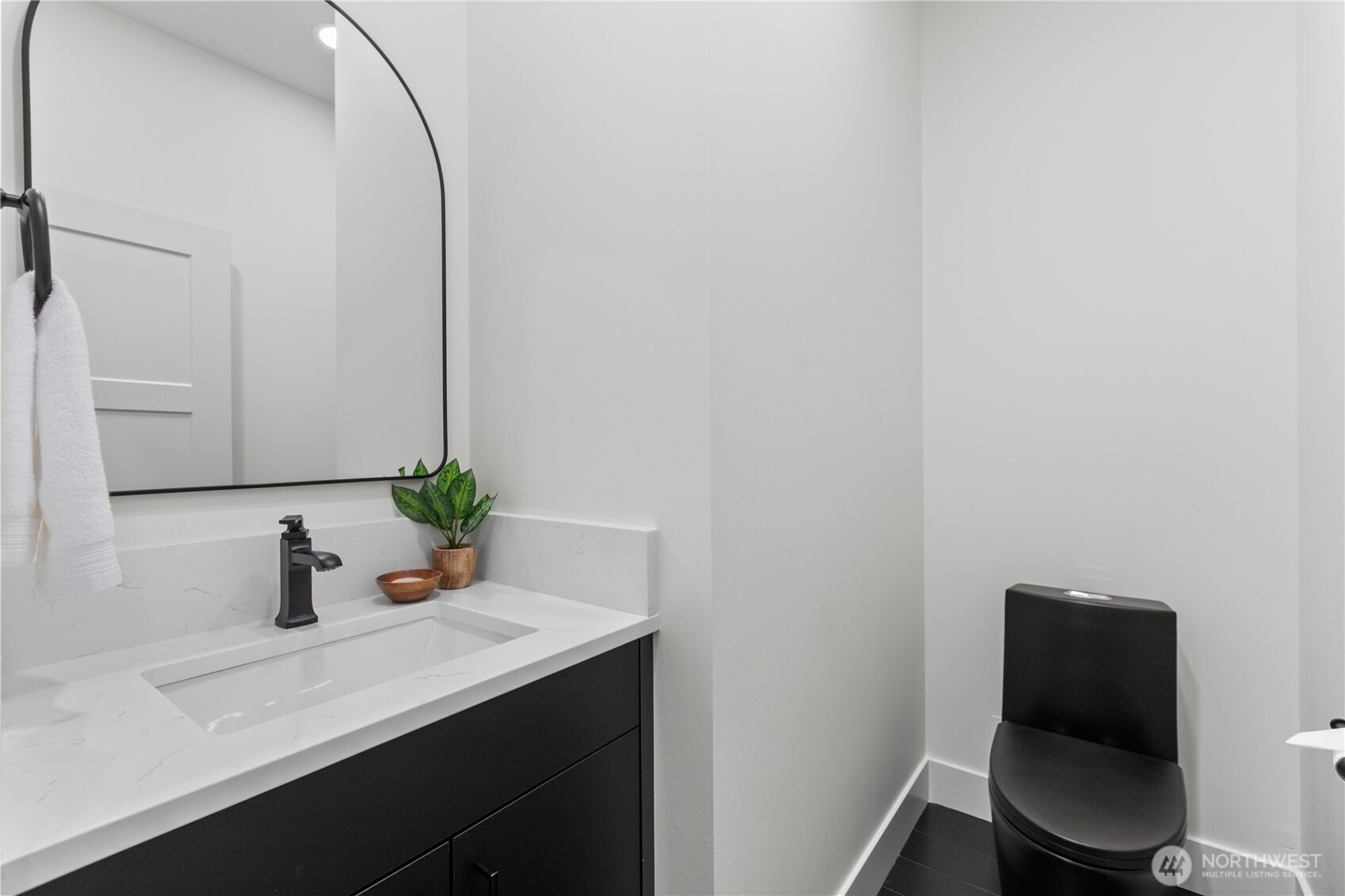 6917 Red Ridge Drive Lynden, WA 98264 - Photo 11 of 40 a bathroom with a sink a toilet and mirror
