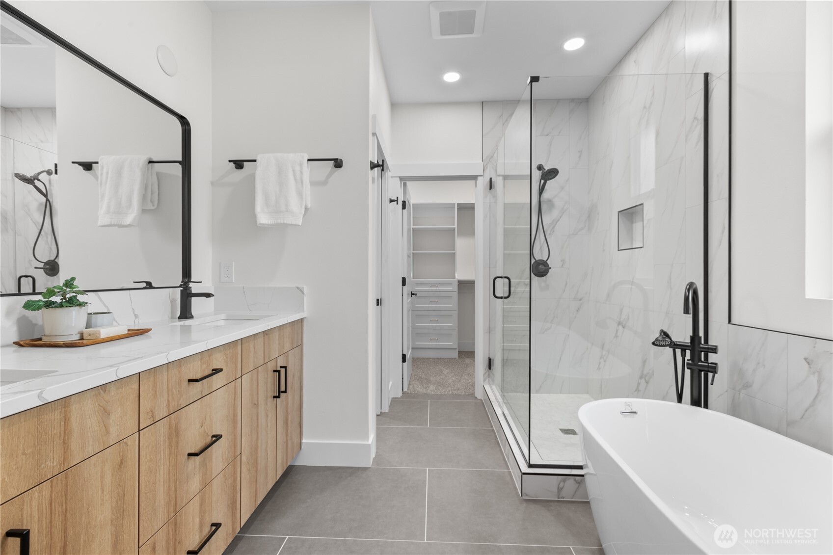 6917 Red Ridge Drive Lynden, WA 98264 - Photo 13 of 40 a bathroom with a tub a sink shower and mirror