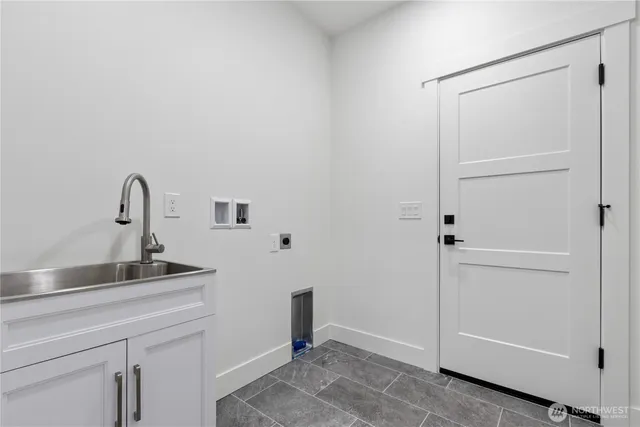 a bathroom with a sink and mirror