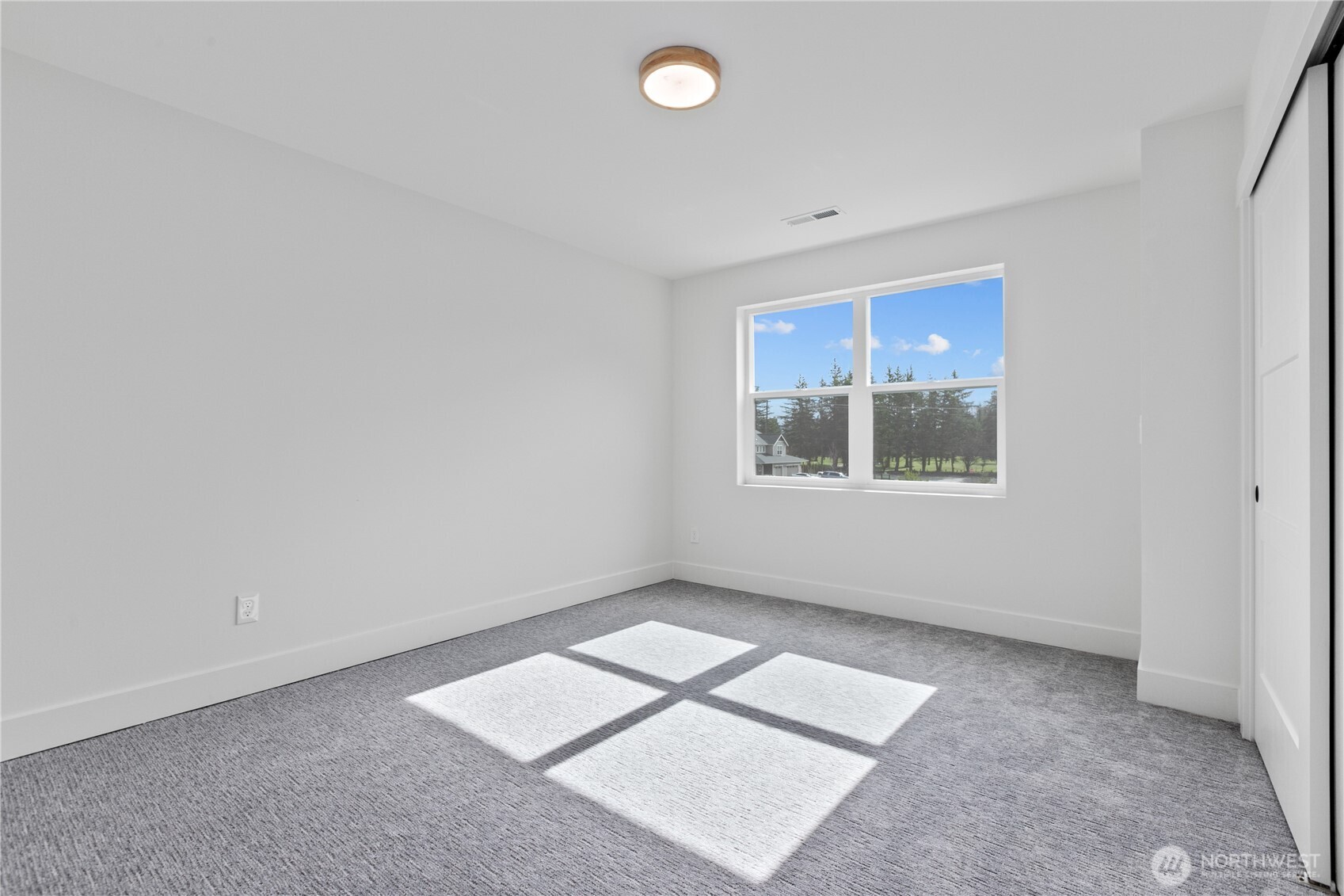 6917 Red Ridge Drive Lynden, WA 98264 - Photo 23 of 40 an empty room with windows and closet