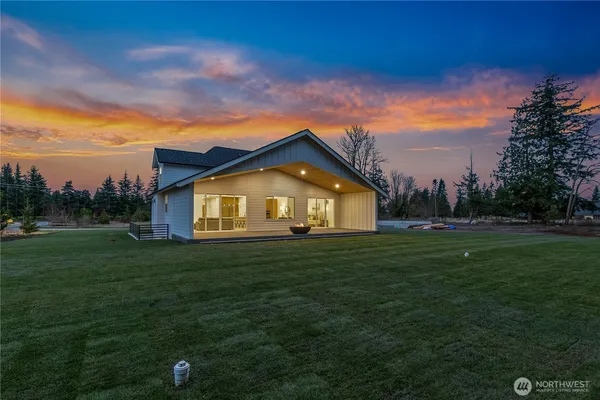 a view of a big house with a big yard
