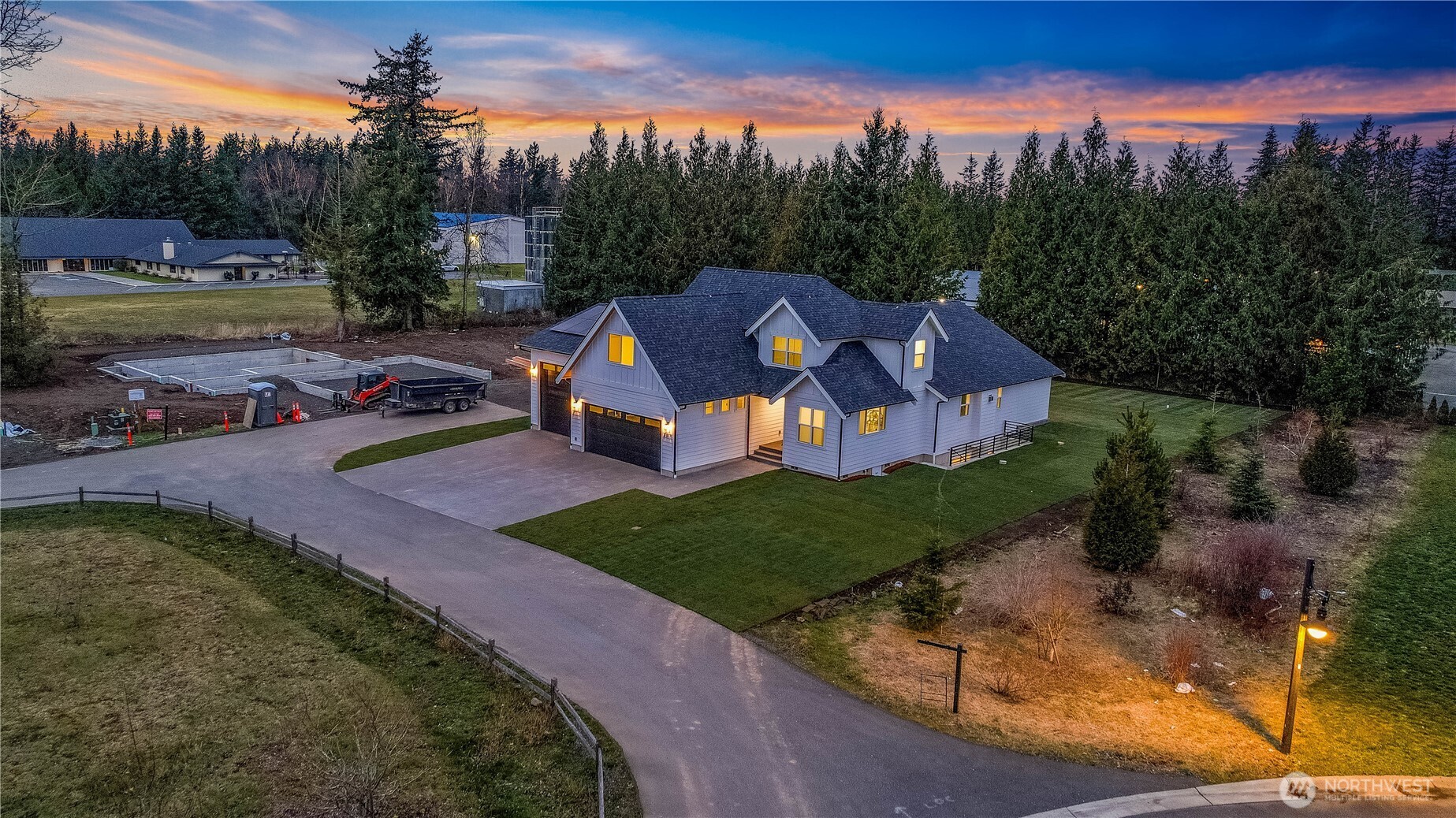 6917 Red Ridge Drive Lynden, WA 98264 - Photo 35 of 40 a view of a house with garden space and a sitting area