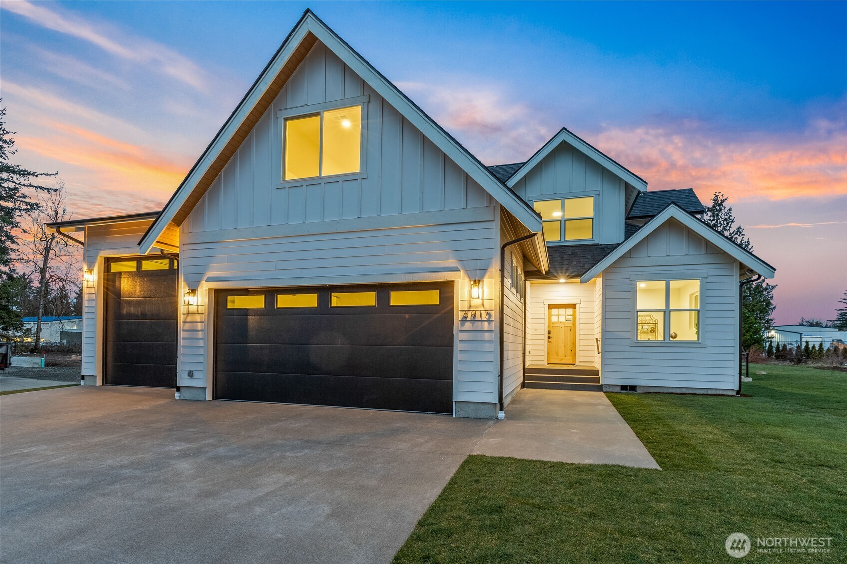 6917 Red Ridge Drive Lynden, WA 98264 - Photo 35 of 40 a front view of a house with a yard and garage