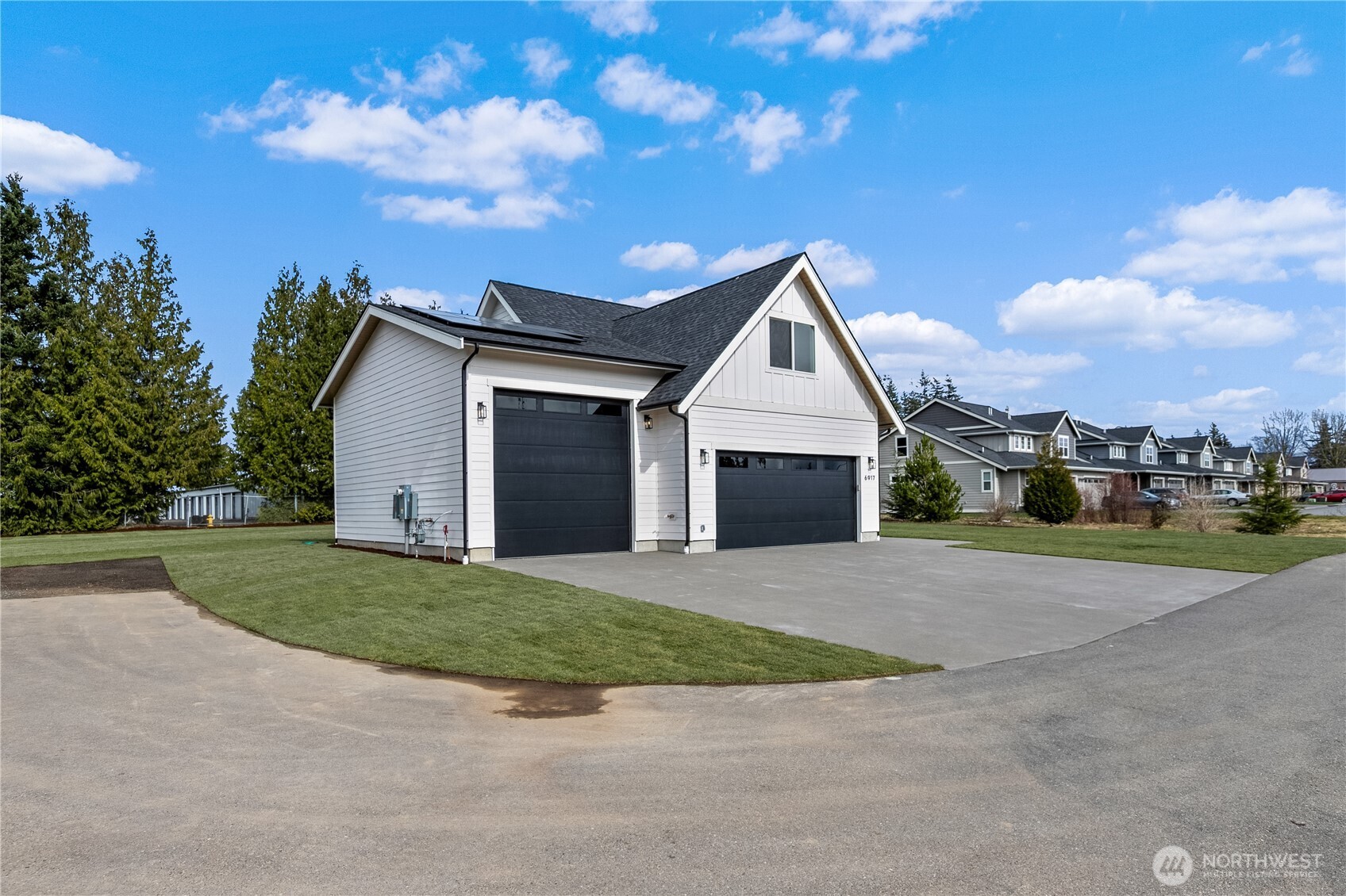 6917 Red Ridge Drive Lynden, WA 98264 - Photo 38 of 40 a front view of a house with a yard and garage