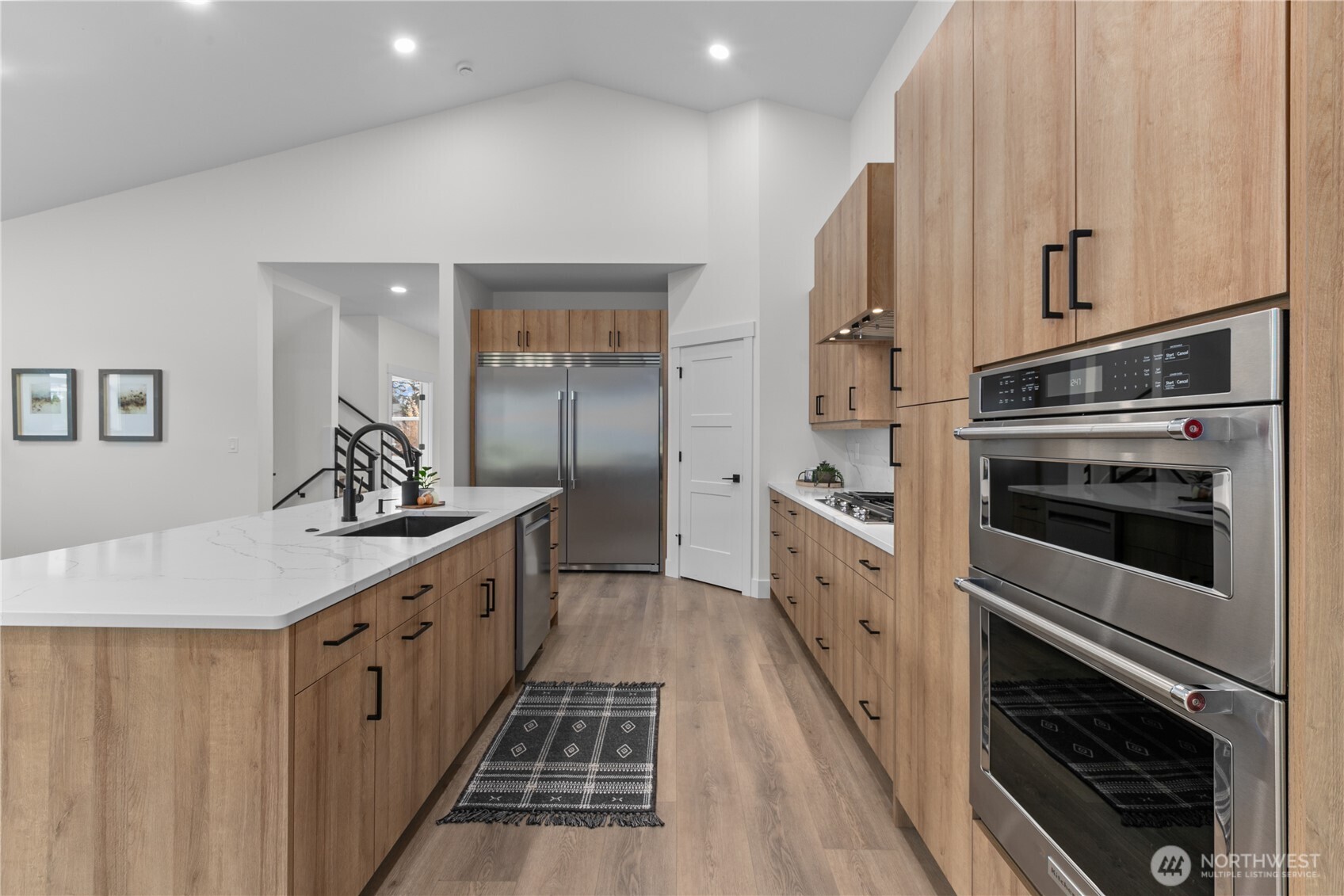 6917 Red Ridge Drive Lynden, WA 98264 - Photo 9 of 40 a kitchen with cabinets and stainless steel appliances