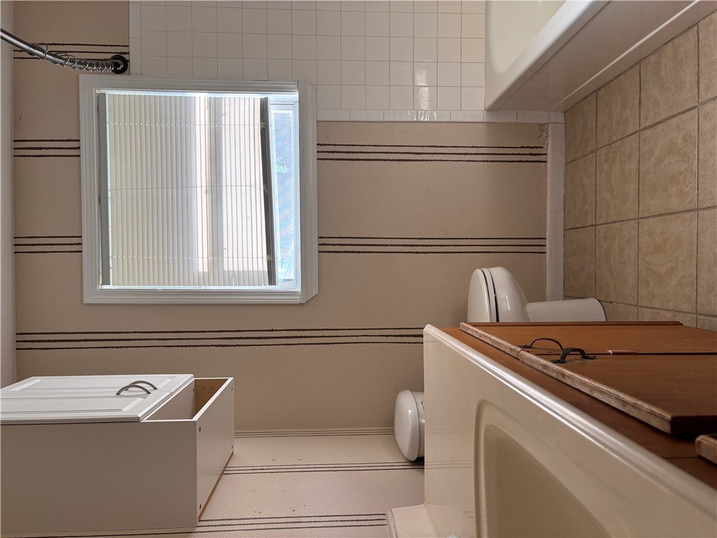 411 Hickory Street Calvert, TX 77837 - Photo 9 of 9 a bathroom with a sink a toilet and vanity