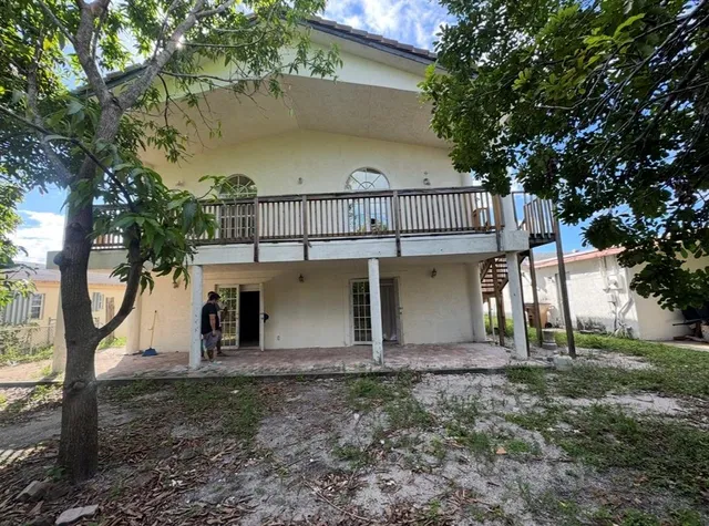 a view of a house with a tree