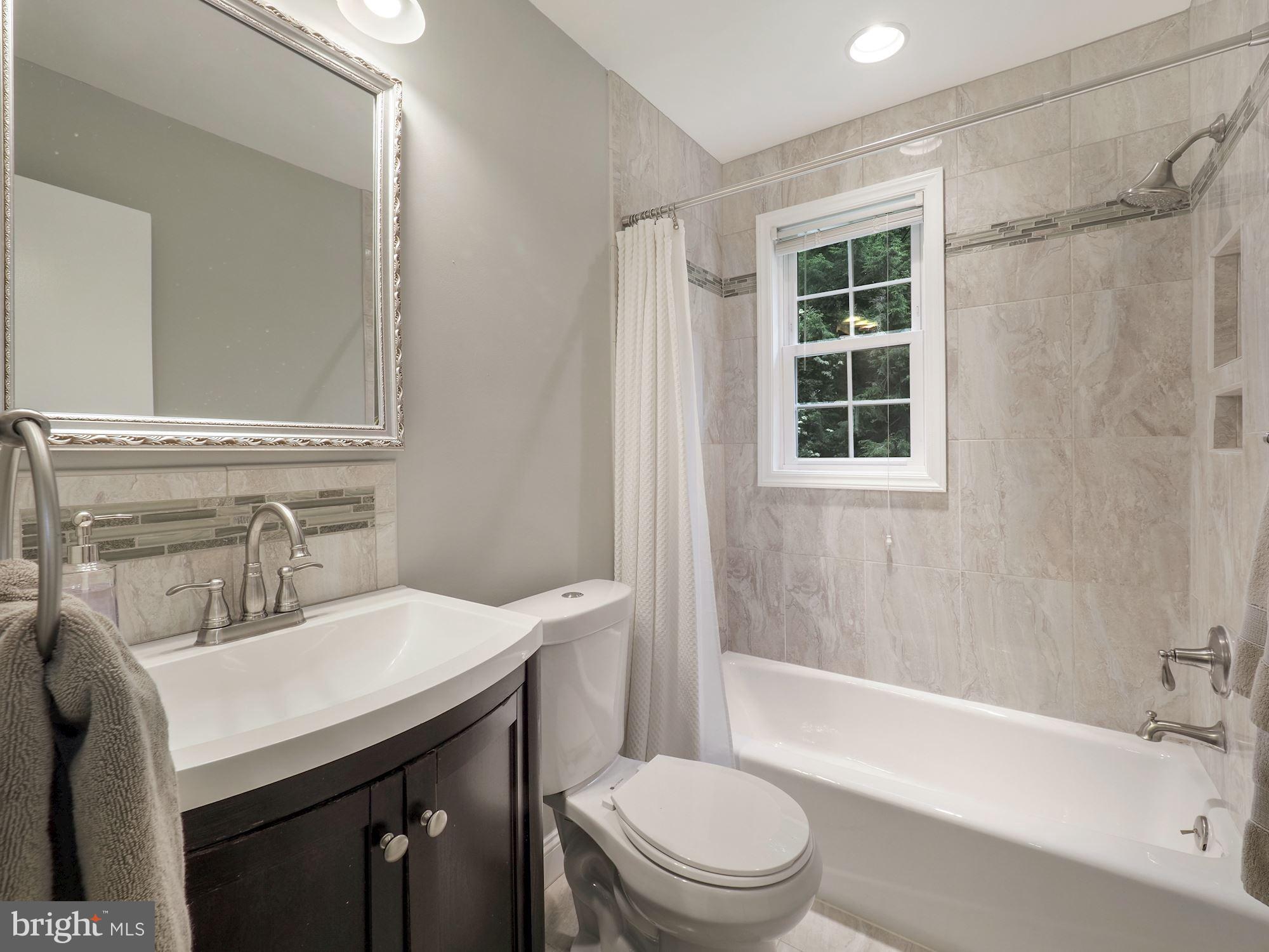 5601 Knollwood Road Bethesda, MD 20816 - Photo 15 of 27 Renovated full hall bath on 2nd floor