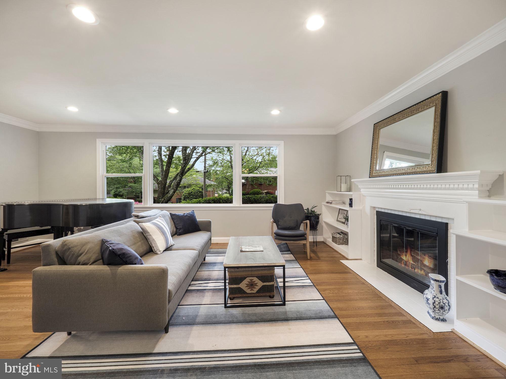 5601 Knollwood Road Bethesda, MD 20816 - Photo 4 of 27 Living room features a big window & fireplace