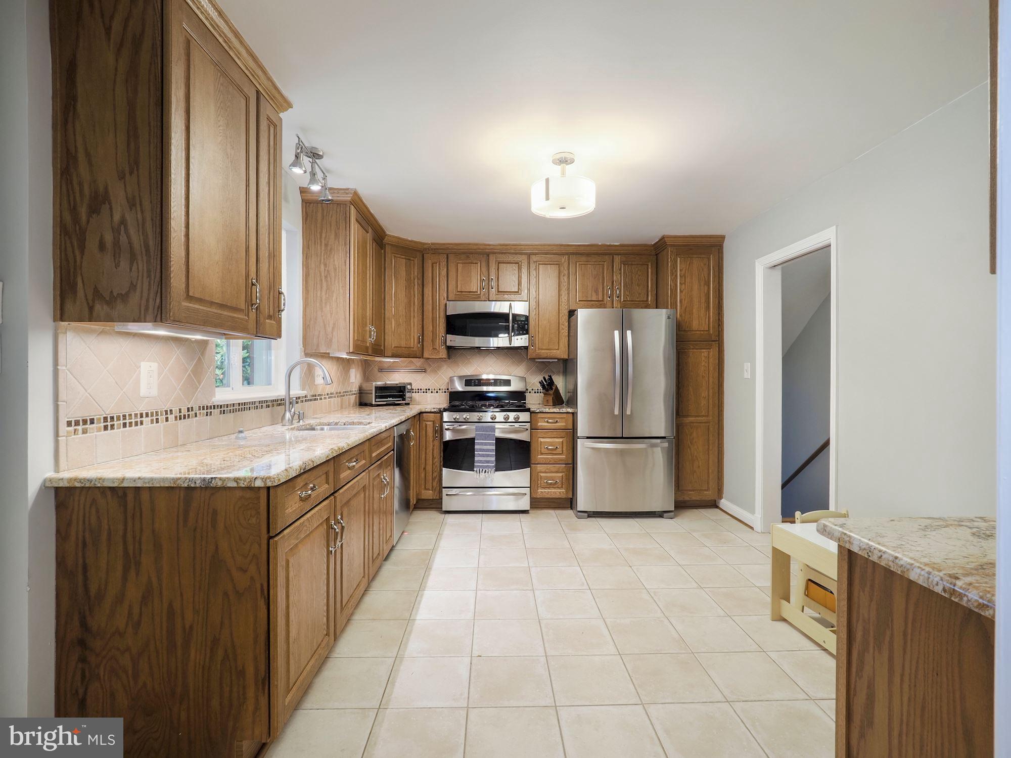 5601 Knollwood Road Bethesda, MD 20816 - Photo 8 of 27 Kitchen accesses hall and dining room