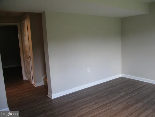 a view of a small space with wooden floor