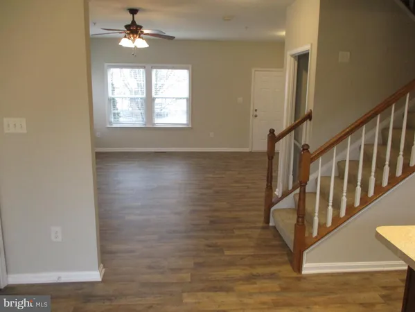 a view of a hallway with carpet