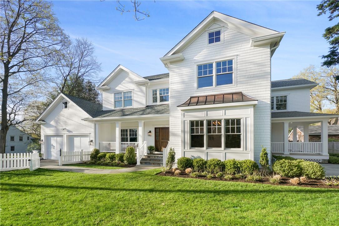 279 Rye Beach Avenue Rye, NY 10580 - Photo 1 of 1 front view of a house with a yard