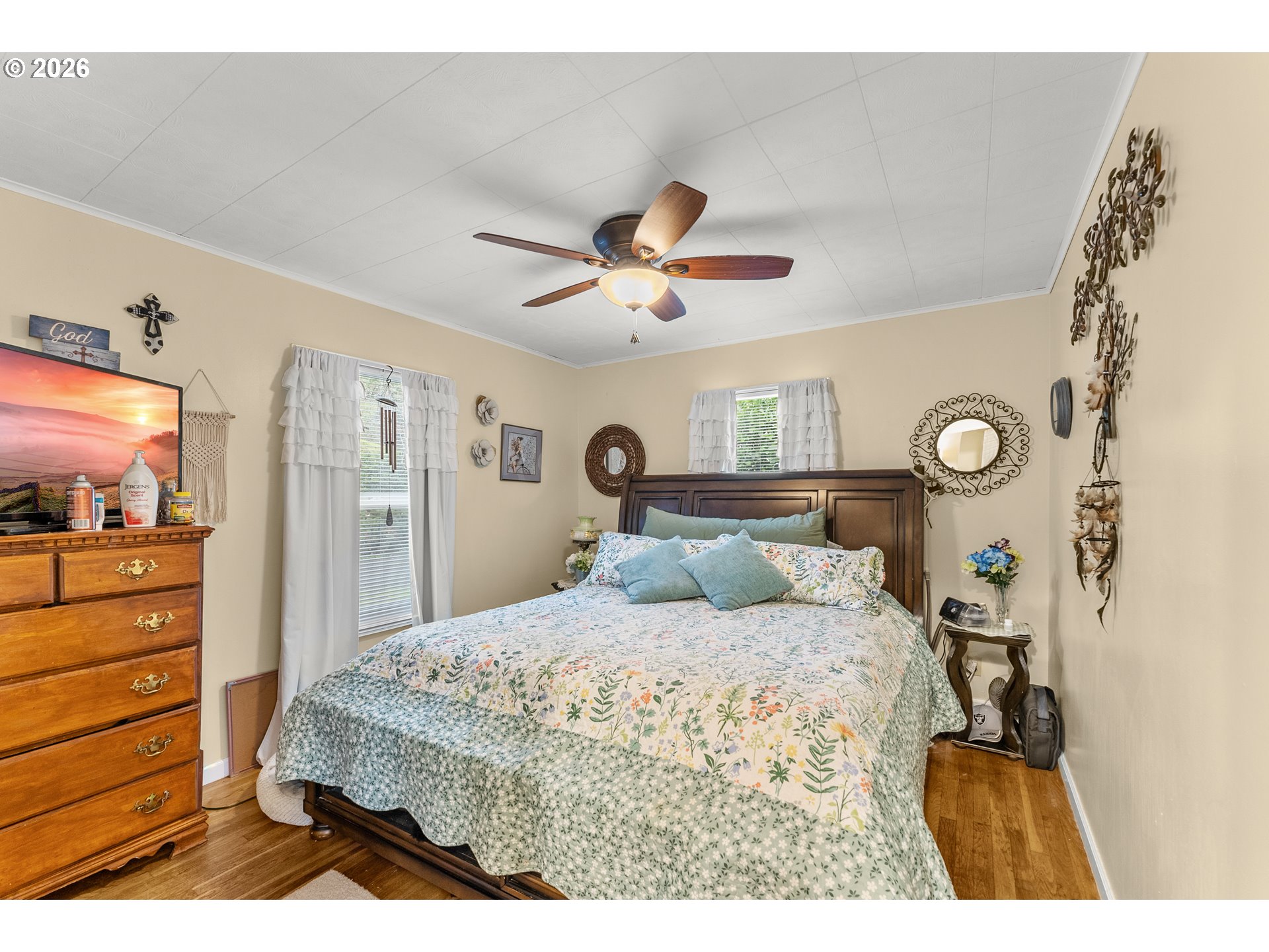 1565 Northeast Todd Street Roseburg, OR 97470 - Photo 13 of 25 a bedroom with a bed and a chandelier