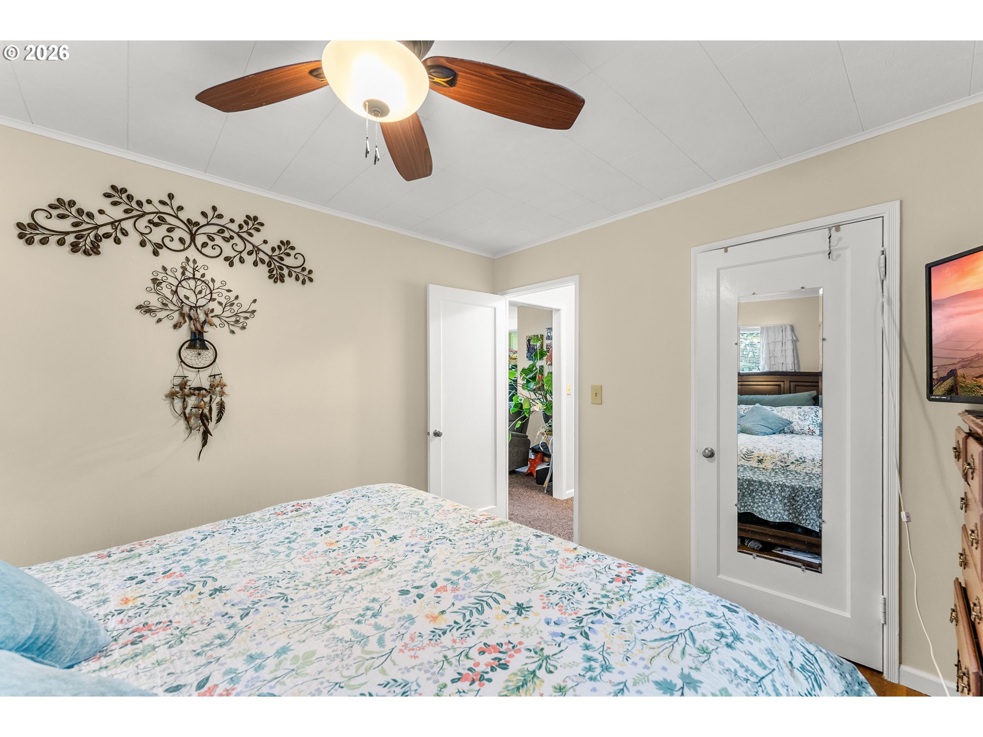 1565 Northeast Todd Street Roseburg, OR 97470 - Photo 14 of 25 a bedroom with a bed and a painting on the wall