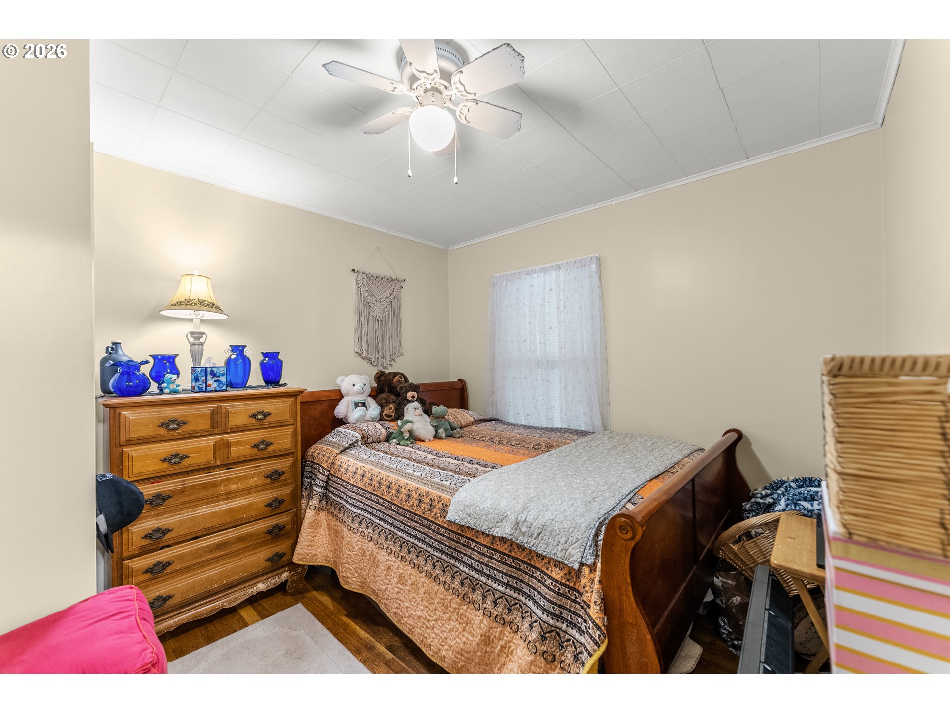 1565 Northeast Todd Street Roseburg, OR 97470 - Photo 15 of 25 a bedroom with a bed and a chandelier