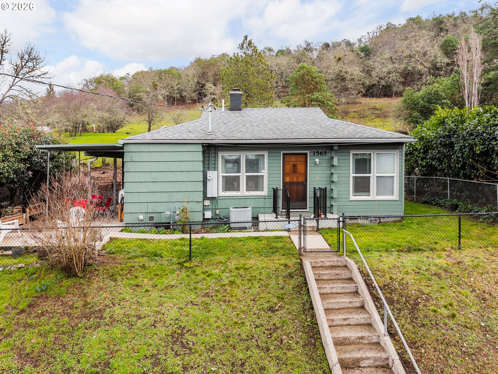 1565 Northeast Todd Street Roseburg, OR 97470 - Photo 24 of 25 a view of a house with pool