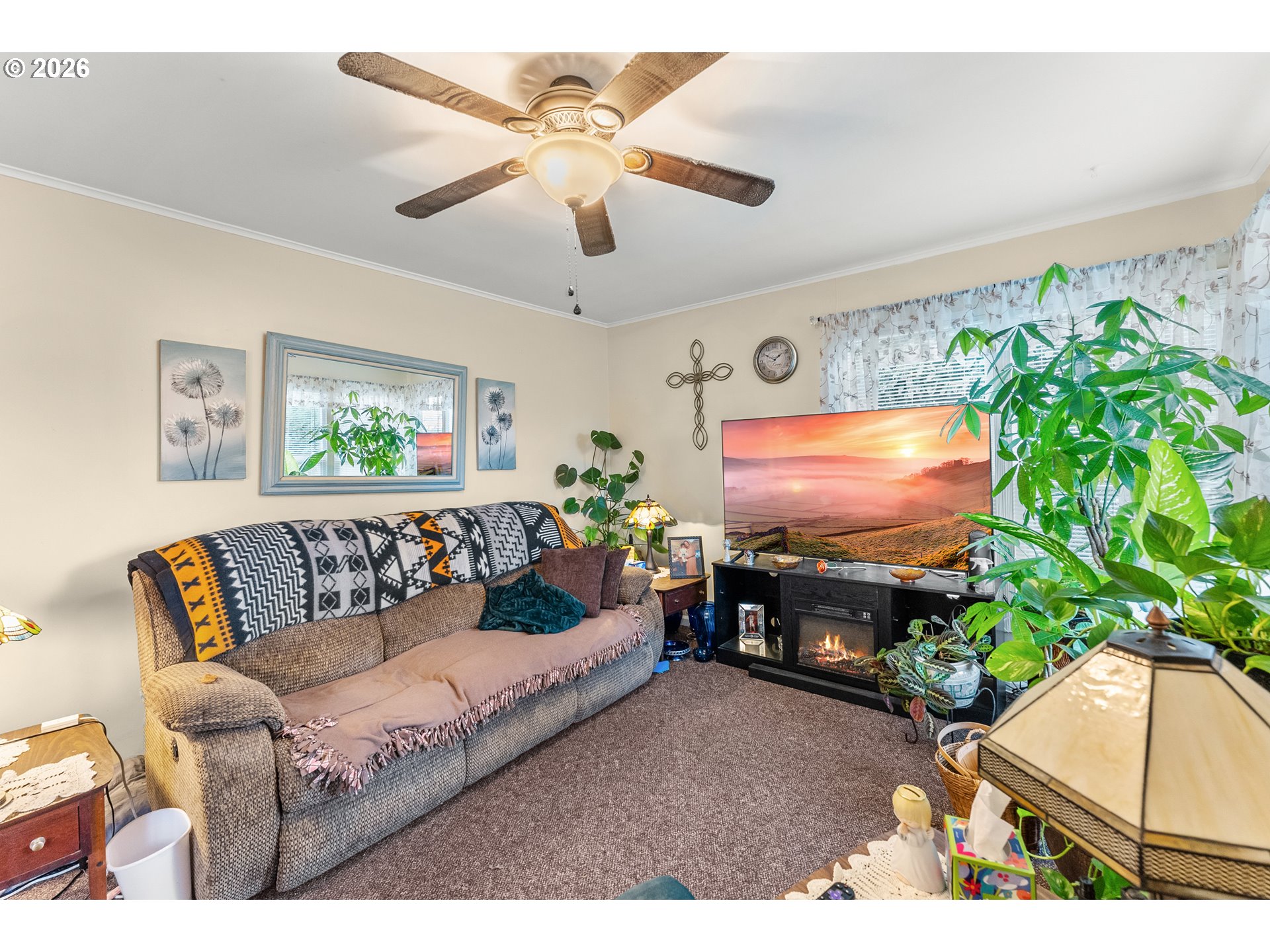 1565 Northeast Todd Street Roseburg, OR 97470 - Photo 3 of 25 a living room with furniture a potted plant and a window