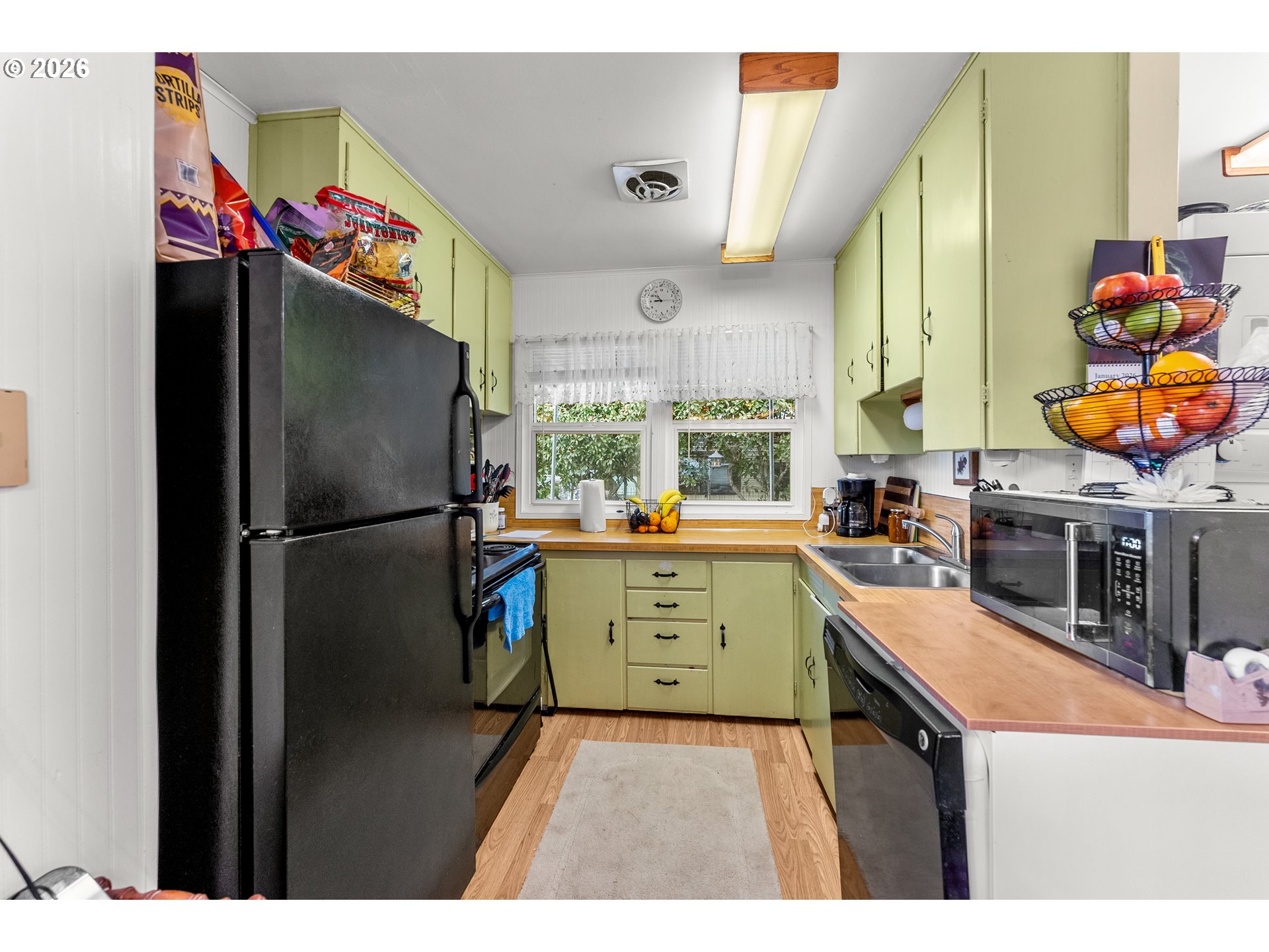1565 Northeast Todd Street Roseburg, OR 97470 - Photo 8 of 25 a kitchen with stainless steel appliances granite countertop a refrigerator and a sink