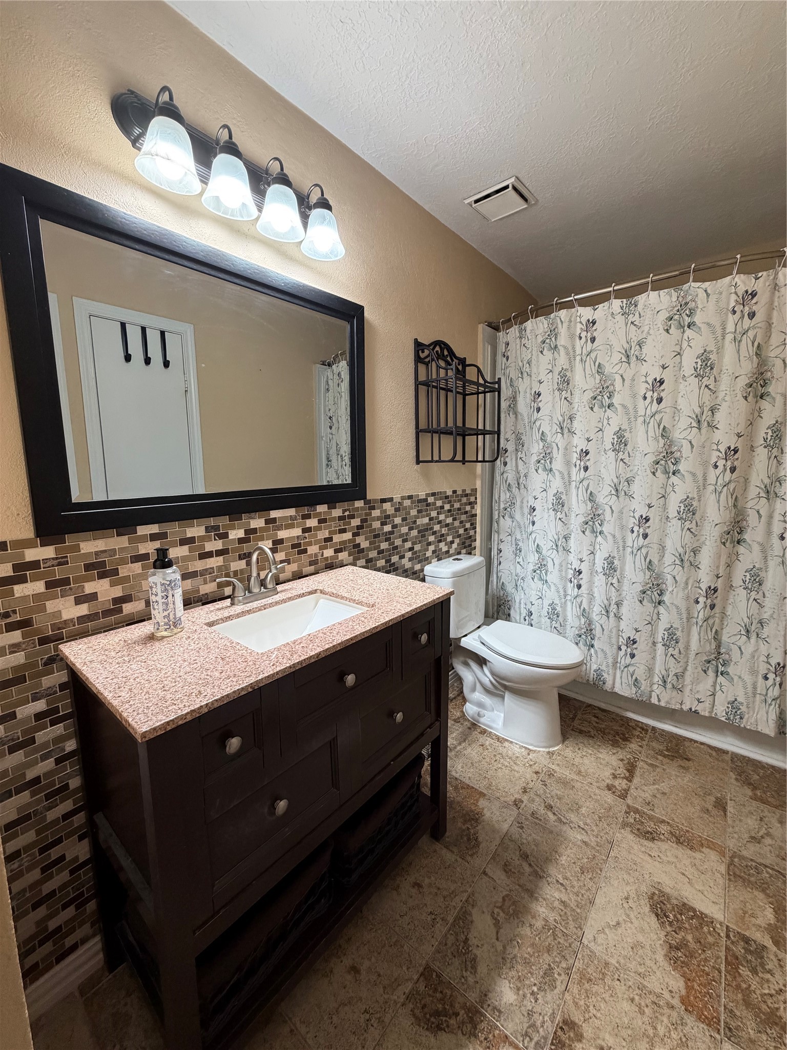 12755 Mill Ridge Drive, Unit 501 Cypress, TX 77429 - Photo 13 of 20 a bathroom with a sink and a mirror