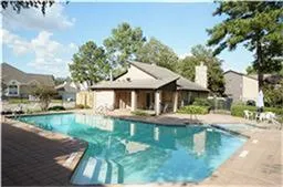 a backyard of a house with yard and outdoor seating