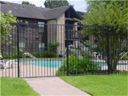 12755 Mill Ridge Drive, Unit 501 Cypress, TX 77429 - Photo 18 of 20 a view of a house with a small yard and wooden fence