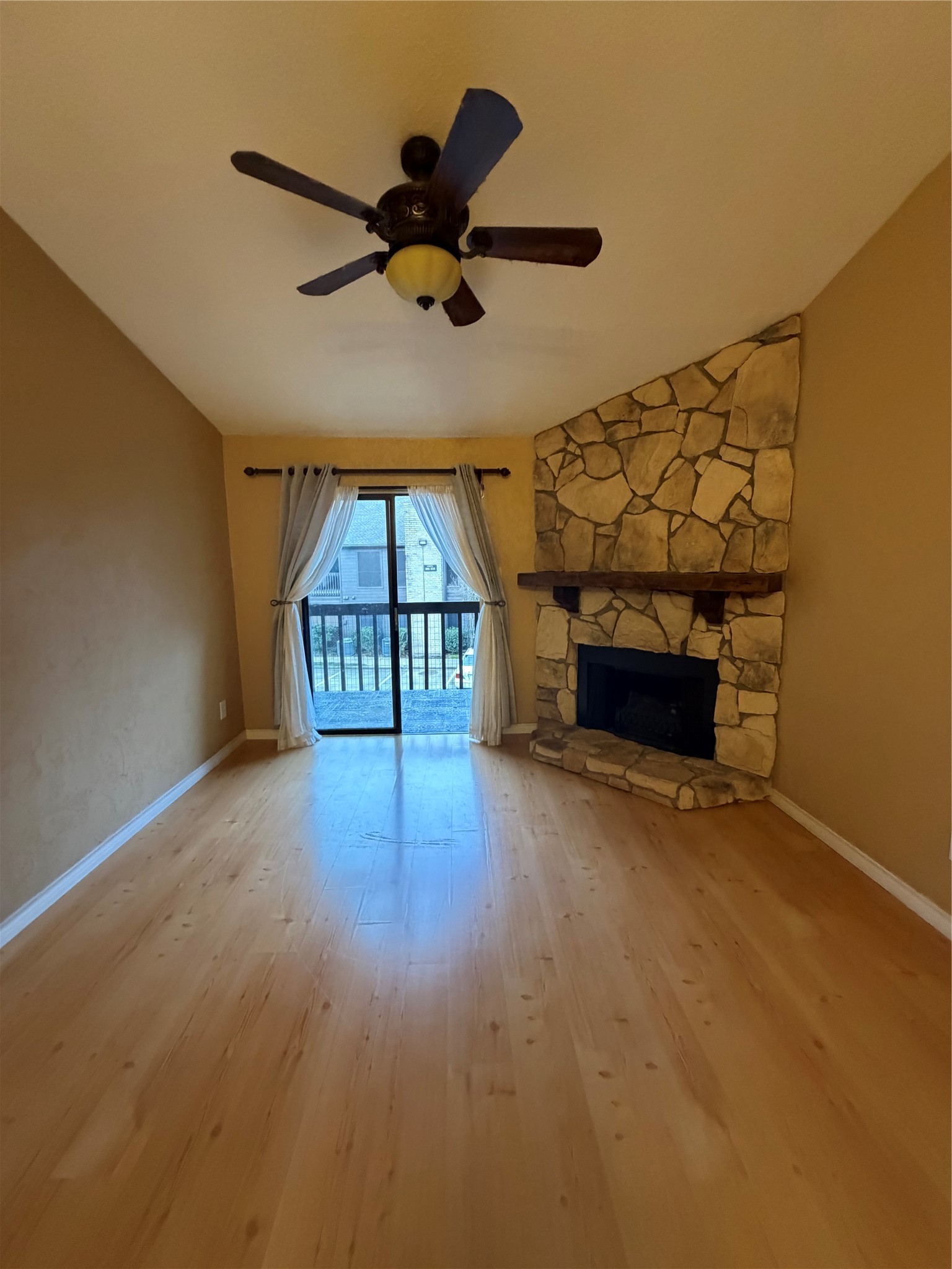 12755 Mill Ridge Drive, Unit 501 Cypress, TX 77429 - Photo 6 of 20 a view of empty room with a fireplace