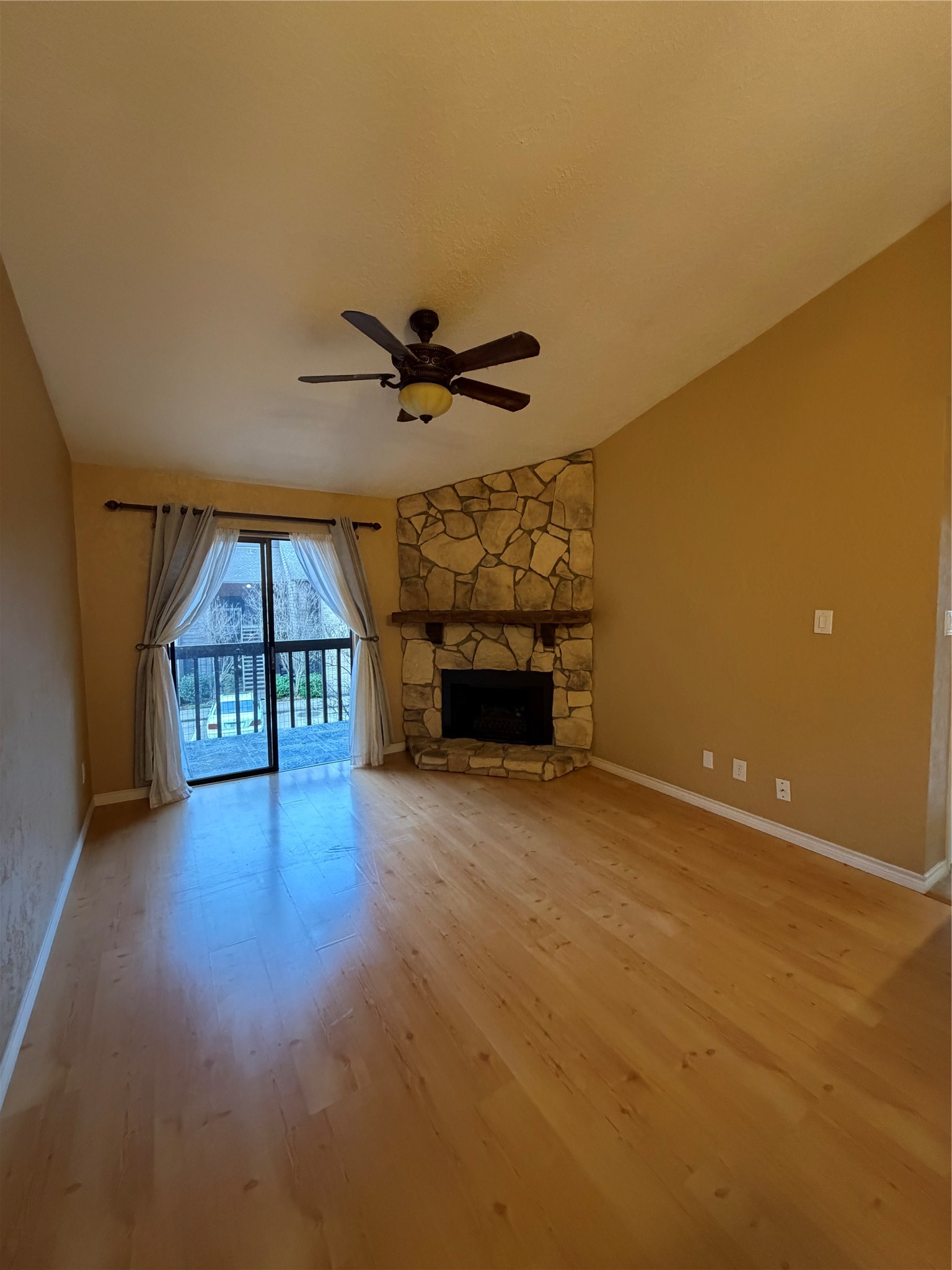 12755 Mill Ridge Drive, Unit 501 Cypress, TX 77429 - Photo 7 of 20 wooden floor in an empty room with a window