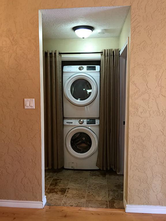 12755 Mill Ridge Drive, Unit 501 Cypress, TX 77429 - Photo 8 of 20 a utility room with dryer and washer