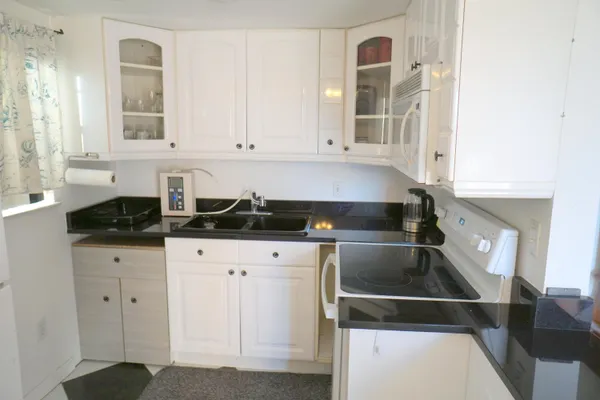 a kitchen with a sink and cabinets