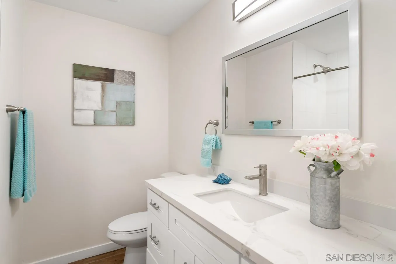 13221 Westmark Way, Unit 26 Poway, CA 92064 - Photo 16 of 42 a bathroom with a granite countertop sink and a toilet
