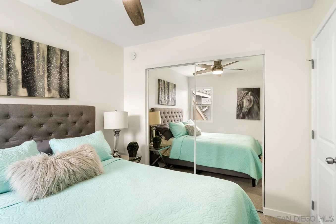 13221 Westmark Way, Unit 26 Poway, CA 92064 - Photo 19 of 42 a bedroom with a large bed and a couch