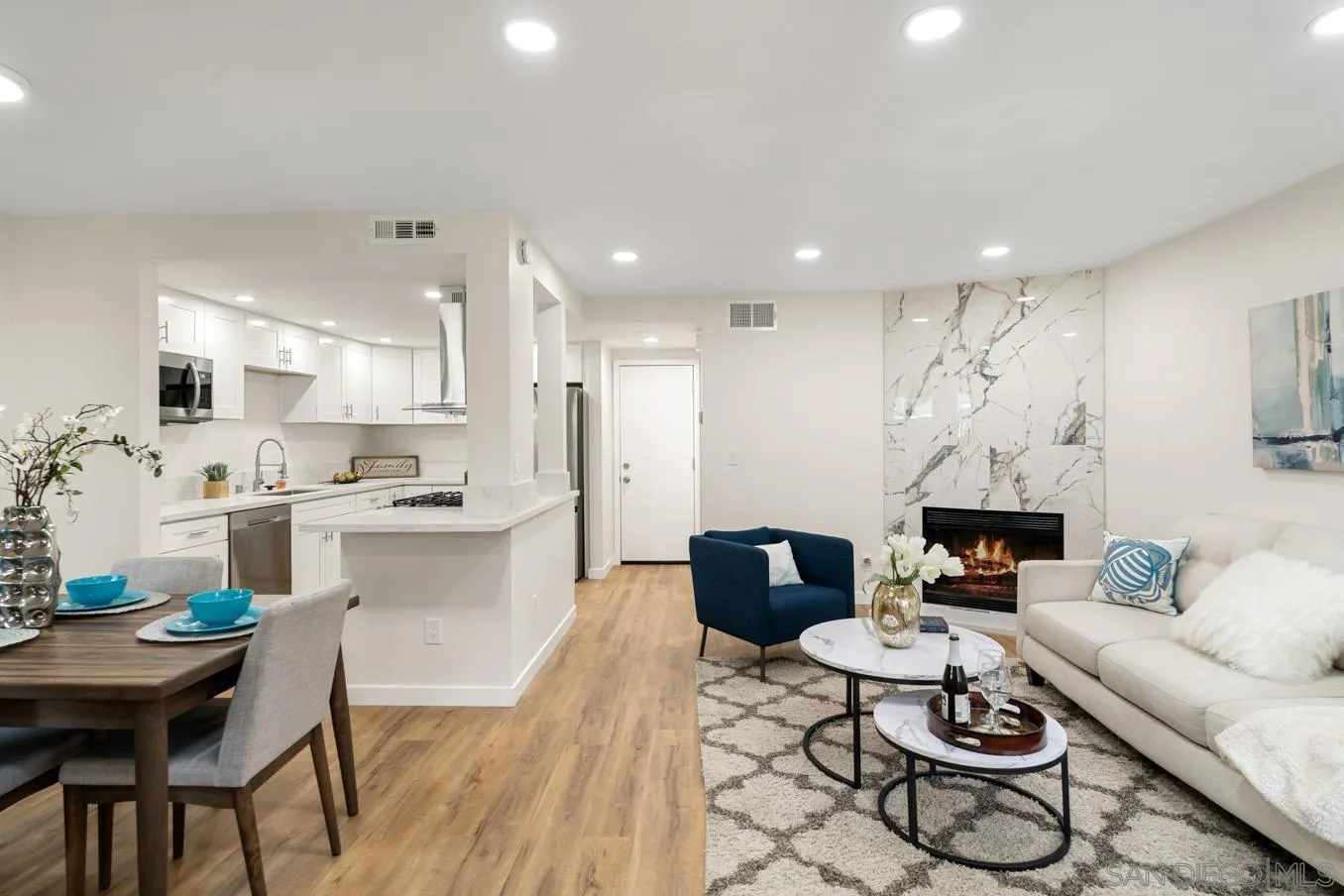 13221 Westmark Way, Unit 26 Poway, CA 92064 - Photo 2 of 42 a living room with furniture kitchen view and a potted plant