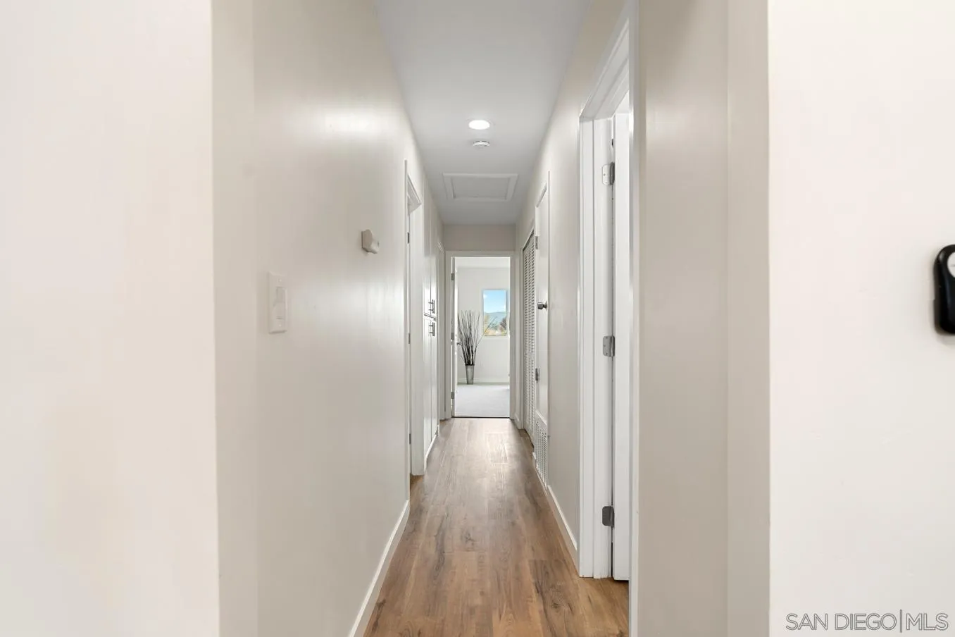 13221 Westmark Way, Unit 26 Poway, CA 92064 - Photo 22 of 42 a view of a hallway with wooden floor