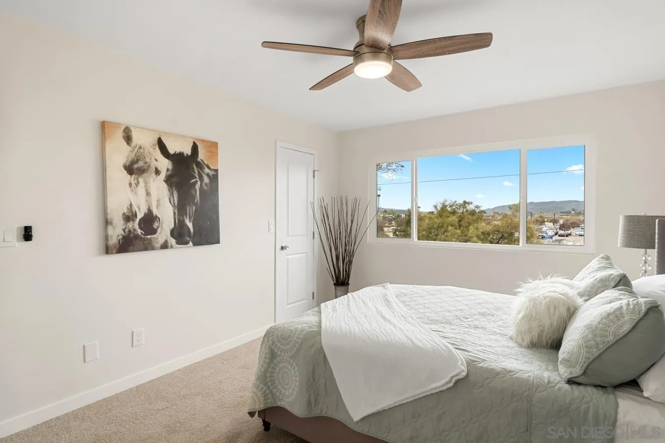 13221 Westmark Way, Unit 26 Poway, CA 92064 - Photo 26 of 42 a bedroom with a large bed and a window