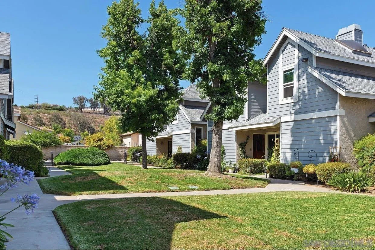 13221 Westmark Way, Unit 26 Poway, CA 92064 - Photo 32 of 42 a front view of a house with a yard