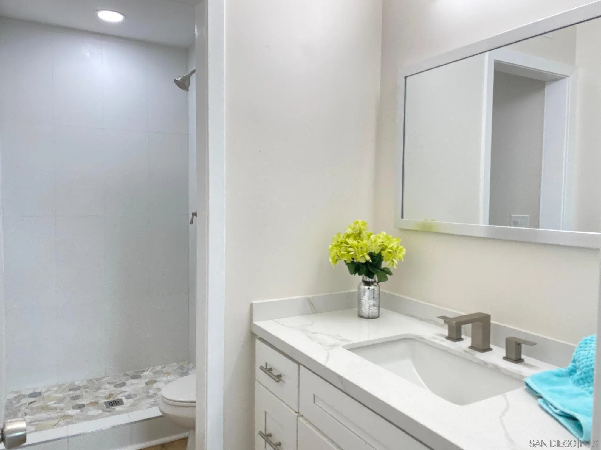 13221 Westmark Way, Unit 26 Poway, CA 92064 - Photo 42 of 42 a bathroom with a granite countertop sink and a mirror