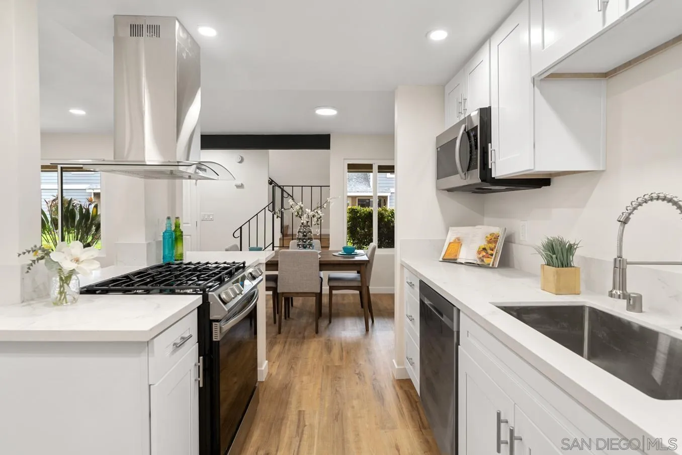 13221 Westmark Way, Unit 26 Poway, CA 92064 - Photo 7 of 42 a kitchen with stainless steel appliances granite countertop a sink stove and cabinets
