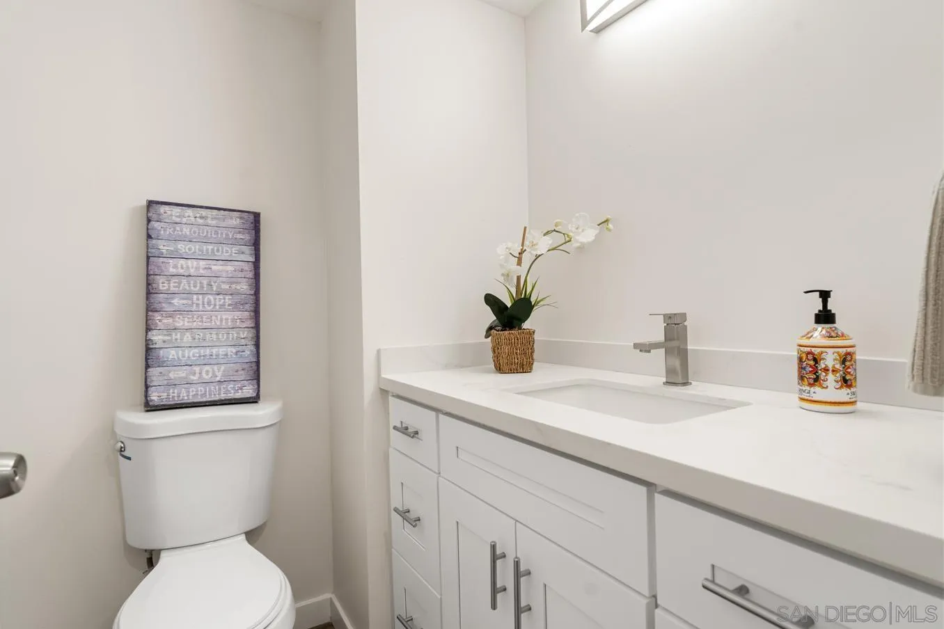 13221 Westmark Way, Unit 26 Poway, CA 92064 - Photo 10 of 42 a bathroom with a toilet a sink and a mirror