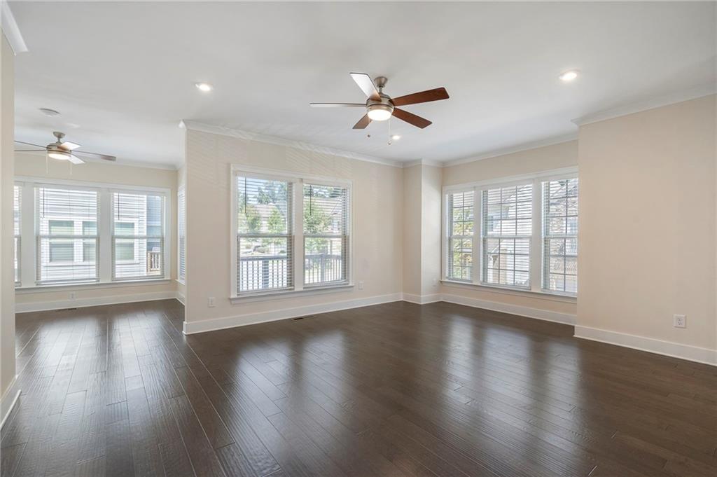 2059 Falls Park Way Decatur, GA 30033 - Photo 12 of 45 a view of an empty room with wooden floor and a window
