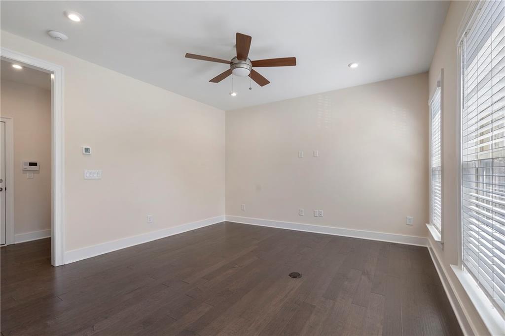 2059 Falls Park Way Decatur, GA 30033 - Photo 15 of 45 en empty room with wooden floor and windows