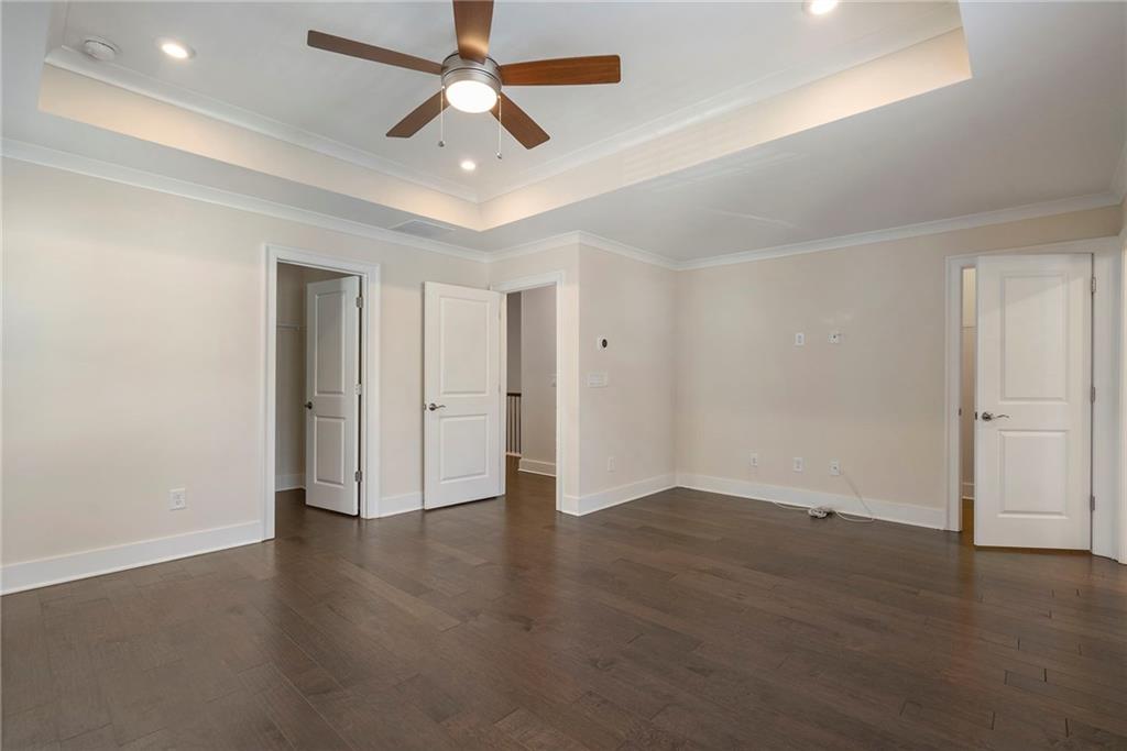 2059 Falls Park Way Decatur, GA 30033 - Photo 22 of 45 an empty room with wooden floor and windows
