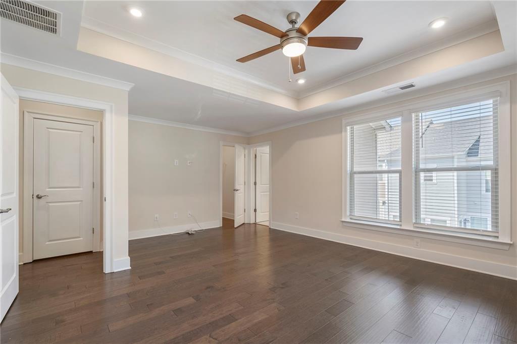 2059 Falls Park Way Decatur, GA 30033 - Photo 23 of 45 a view of an empty room with wooden floor and a window
